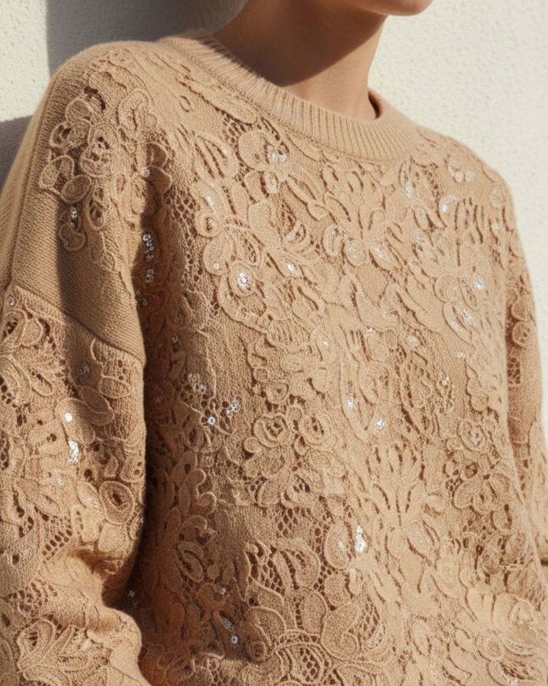 Detail of knitwear embroidered with sequins, a top-tier piece